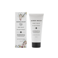 Bondi Wash Baby Balm shown with its retail box and squeeze tube on a plain white background. The packaging features a white design with black text and delicate floral illustrations.