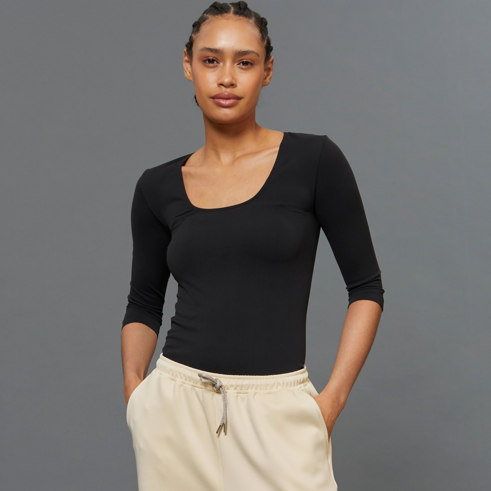 BeGood ¾ sleeve shaping top in black, showcasing its fitted design and smooth fabric for a sleek, flattering look.