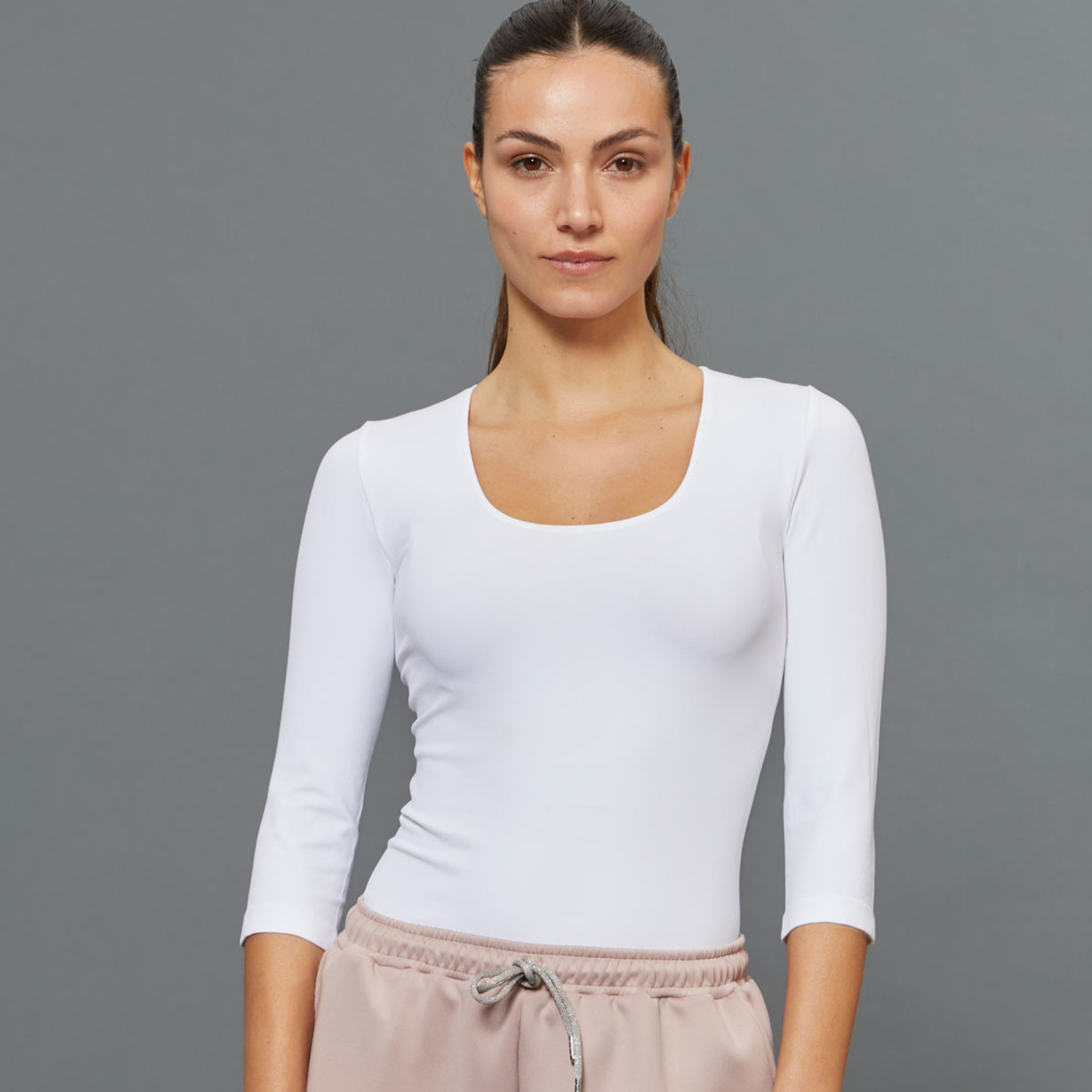 White BeGood ¾ sleeve shaping top, a stylish beauty clothing piece with comfortable fit and flattering silhouette.