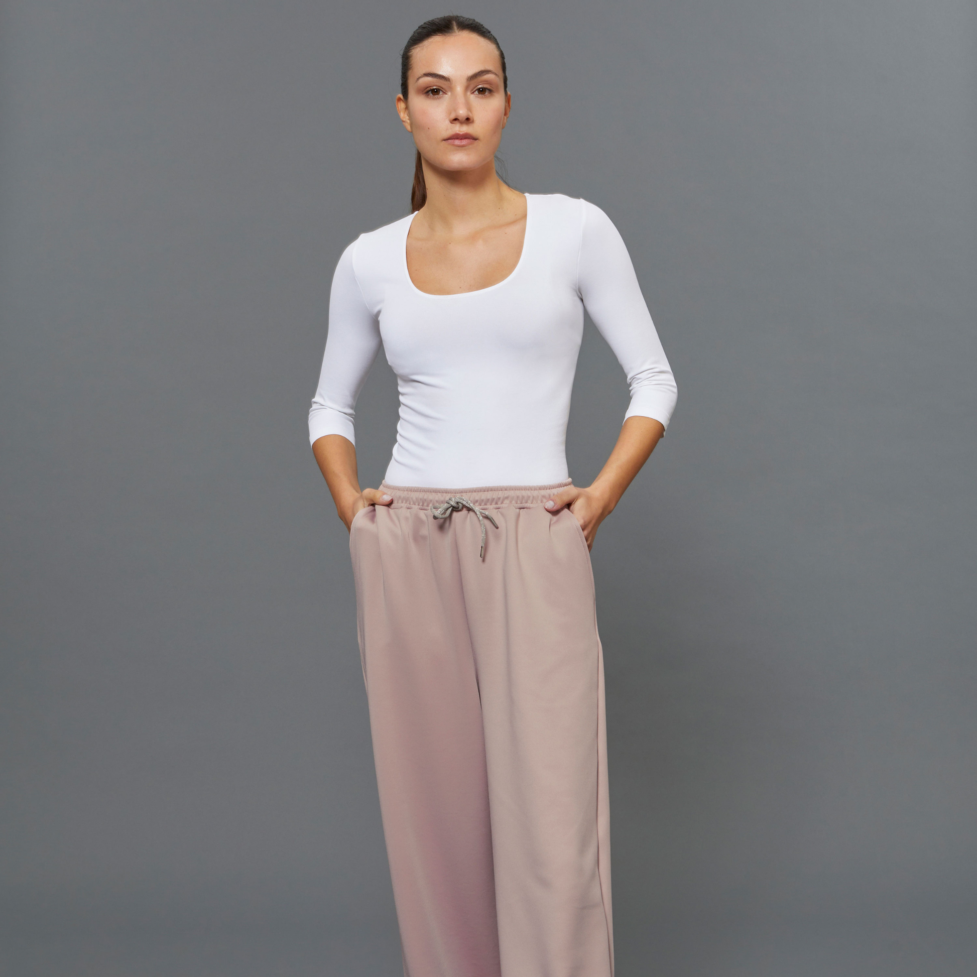BeGood ¾ sleeve shaping top in white, close-up of smooth, fitted beauty clothing design with ¾ length sleeves.