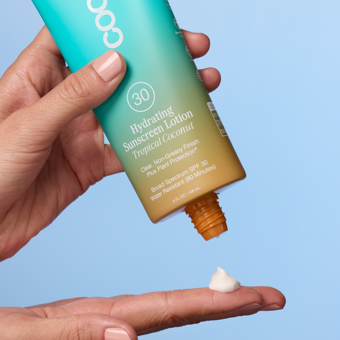 Coola Hydrating Sunscreen Lotion SPF30 with tropical coconut scent, showing the tube with tropical-themed packaging.