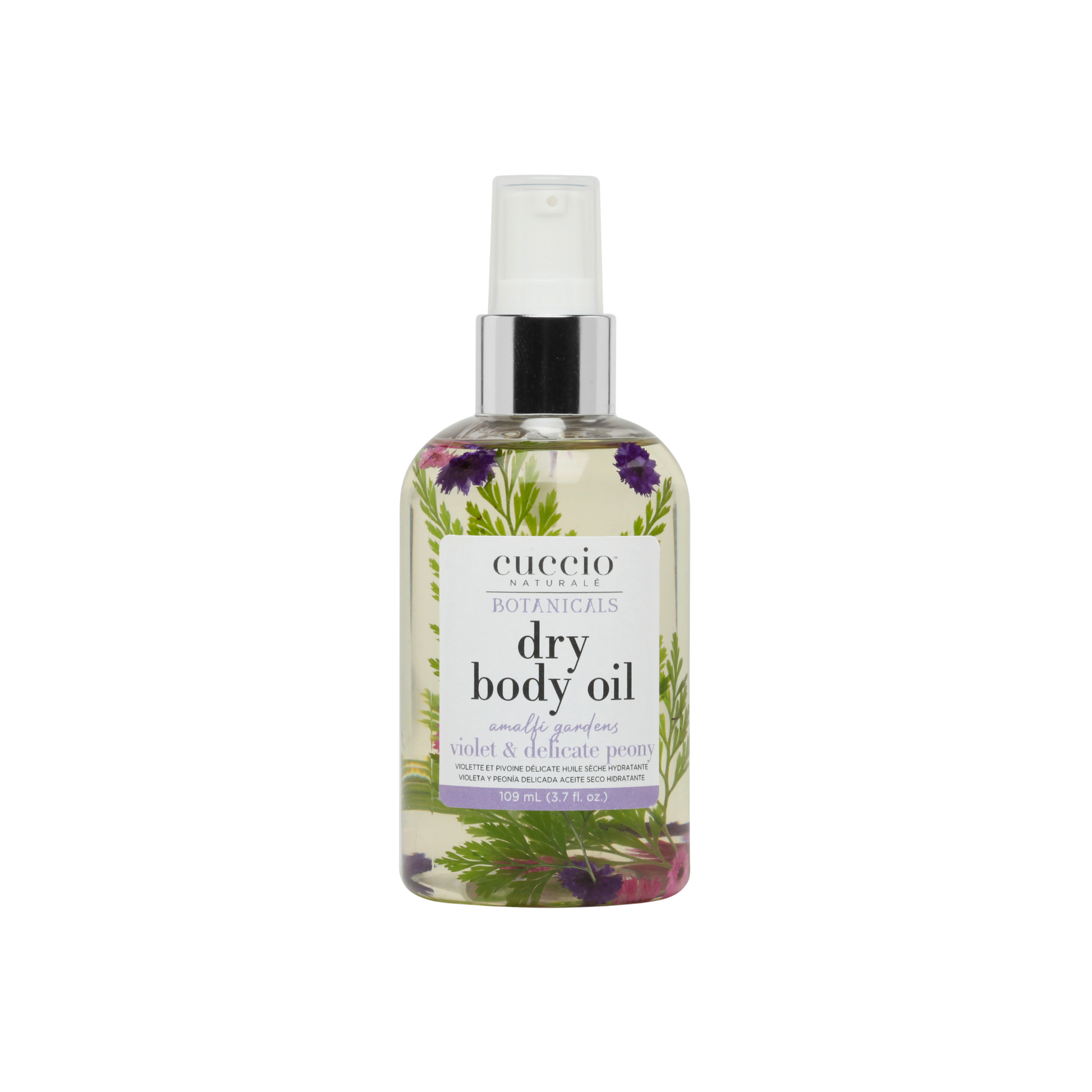 Cuccio dry body oil bottle with floral design on a white background