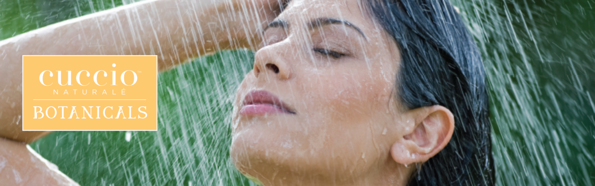 Woman showering with 'Cuccio Botanicals' logo in the corner