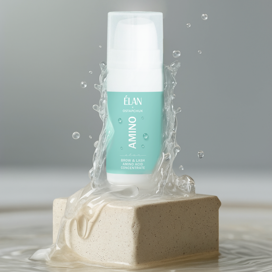 Close-up of Élan Cosmetics AMINO Brow & Lash Amino Acid Concentrate bottle with applicator brush, designed for lash and brow aftercare.