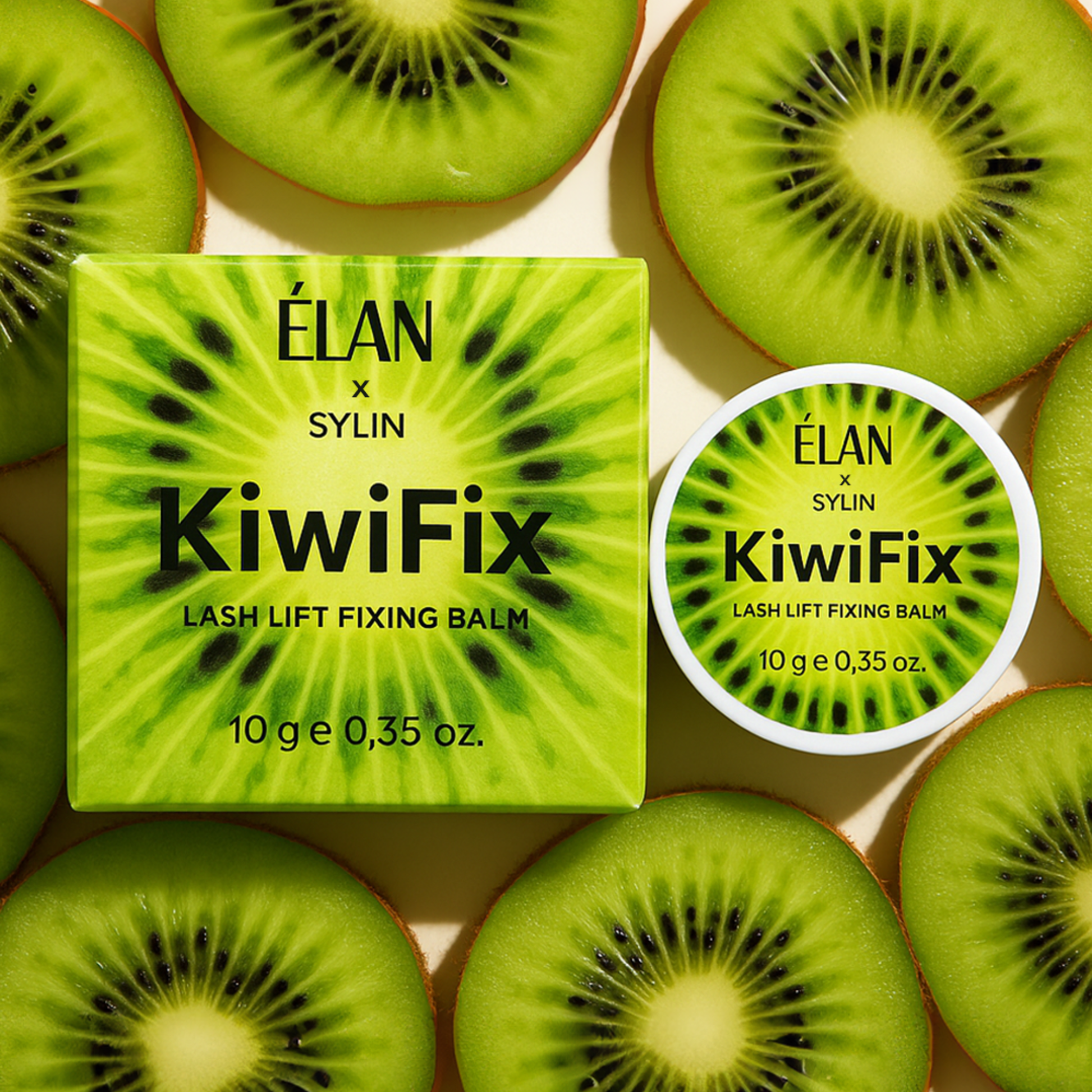 Elan Sylin KiwiFix lash lift fixing balm surrounded by sliced kiwis on a light background