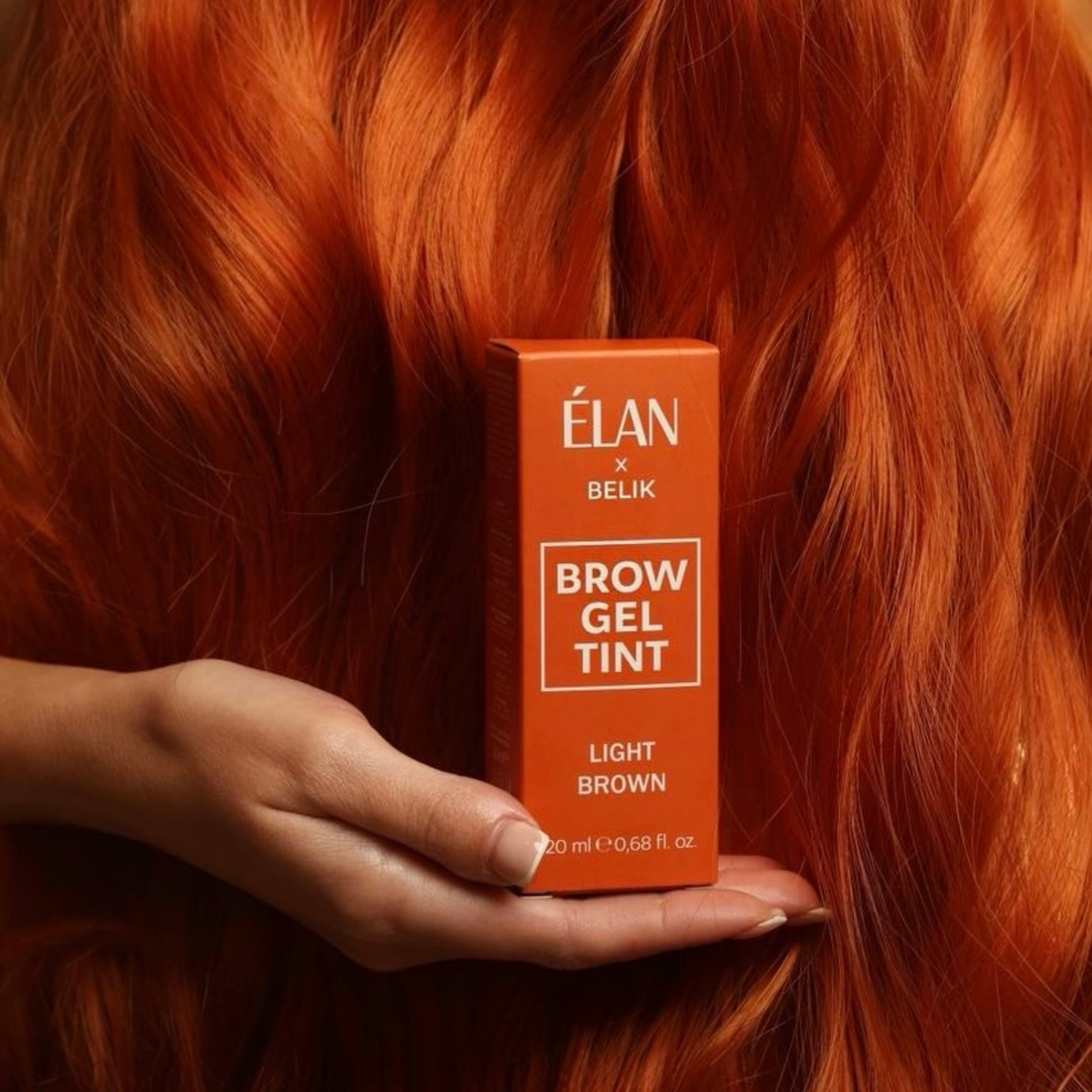 Light brown Élan Brow Gel Tint in a 20ml tube, designed for natural-looking tinted lashes and brows by Élan Cosmetics.