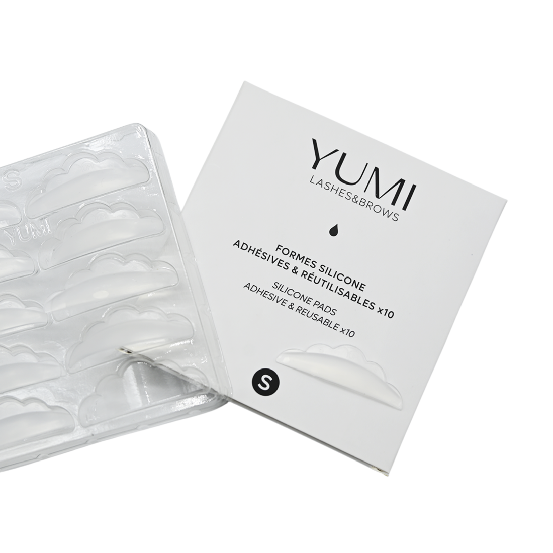 Yumi Lashes & Brows adhesive pads packaging and clear silicone adhesive pad tray on a white background, labeled size S.