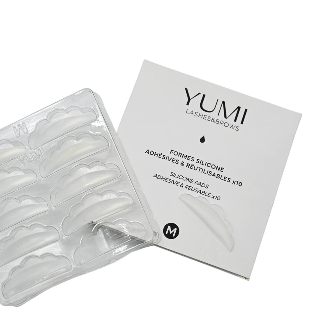 Yumi Lashes & Brows adhesive pads packaging and clear silicone adhesive pad tray on a white background, labeled size S.