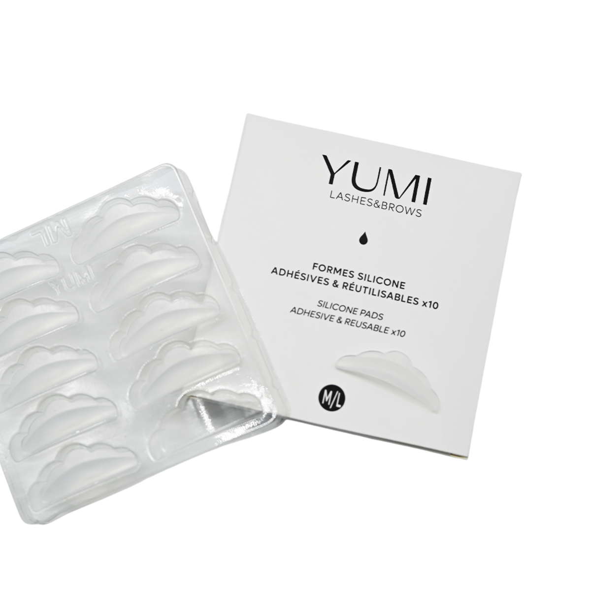 Yumi Lashes & Brows silicone adhesive pad packaging and a clear plastic tray of reusable adhesive pads on a white background. Labeled size M/L.