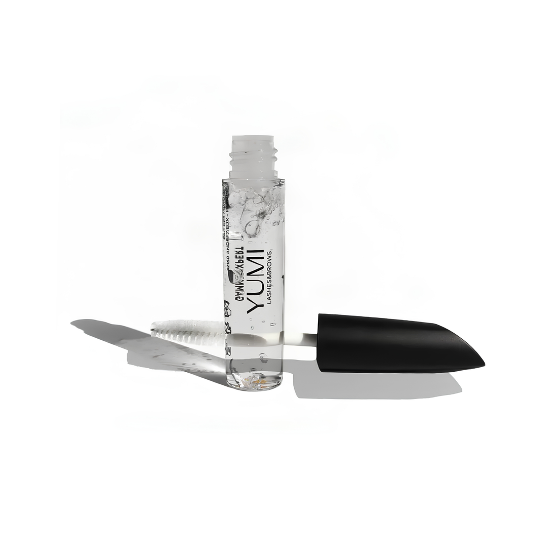 Yumi Lashes Mascara Nourish Serum aftercare for lashes and brows, with a sleek bottle and applicator wand.