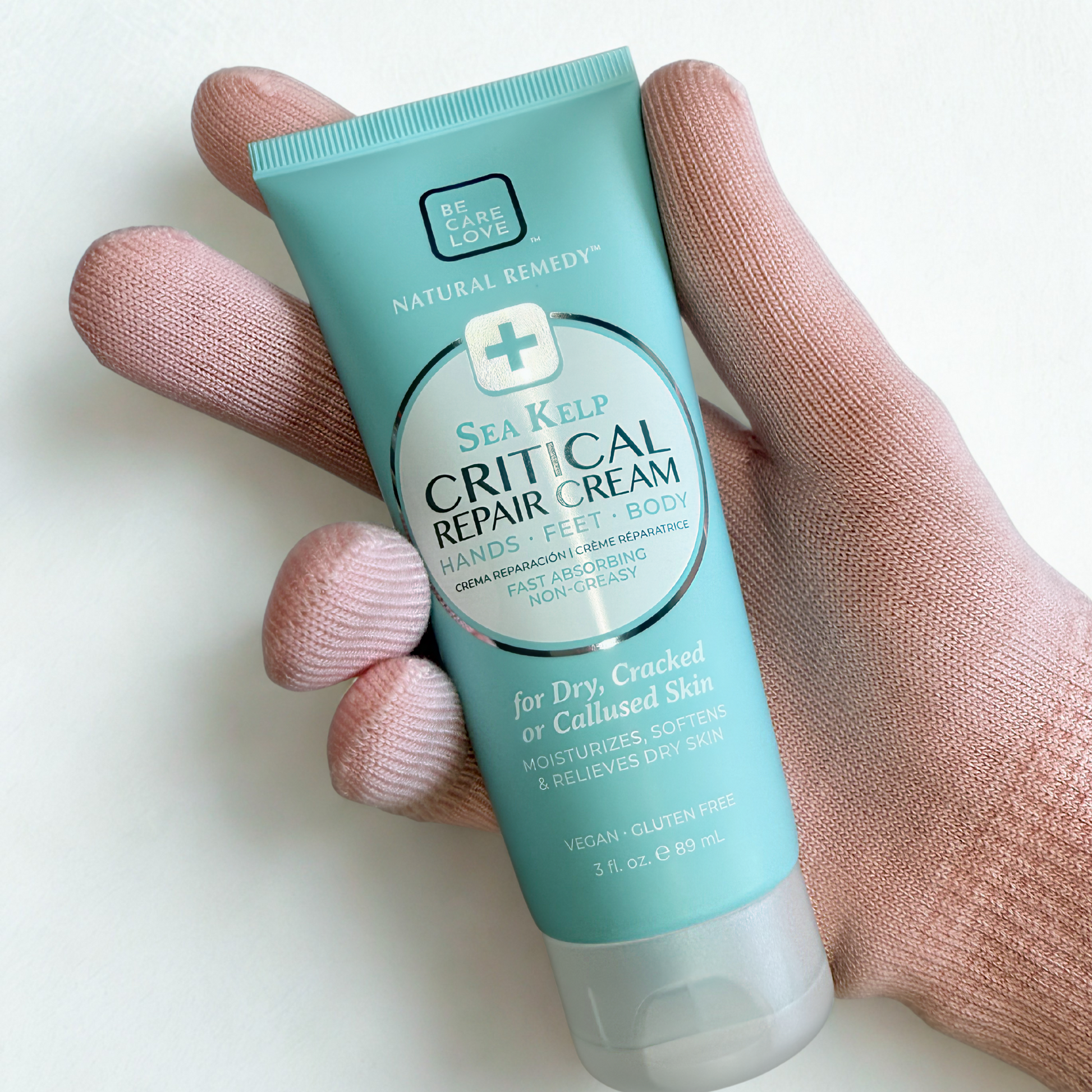 BCL SPA Hand Kit with moisturizing gloves and cream for soft, nourished hands, featuring a white and pink glove design.