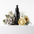 Bondi Wash deodorant spray bottle with a white and blue label, designed for freshening and odor control.