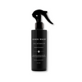 Bondi Wash dog detangler spray bottle with a happy dog, showing the natural ingredients and product label.