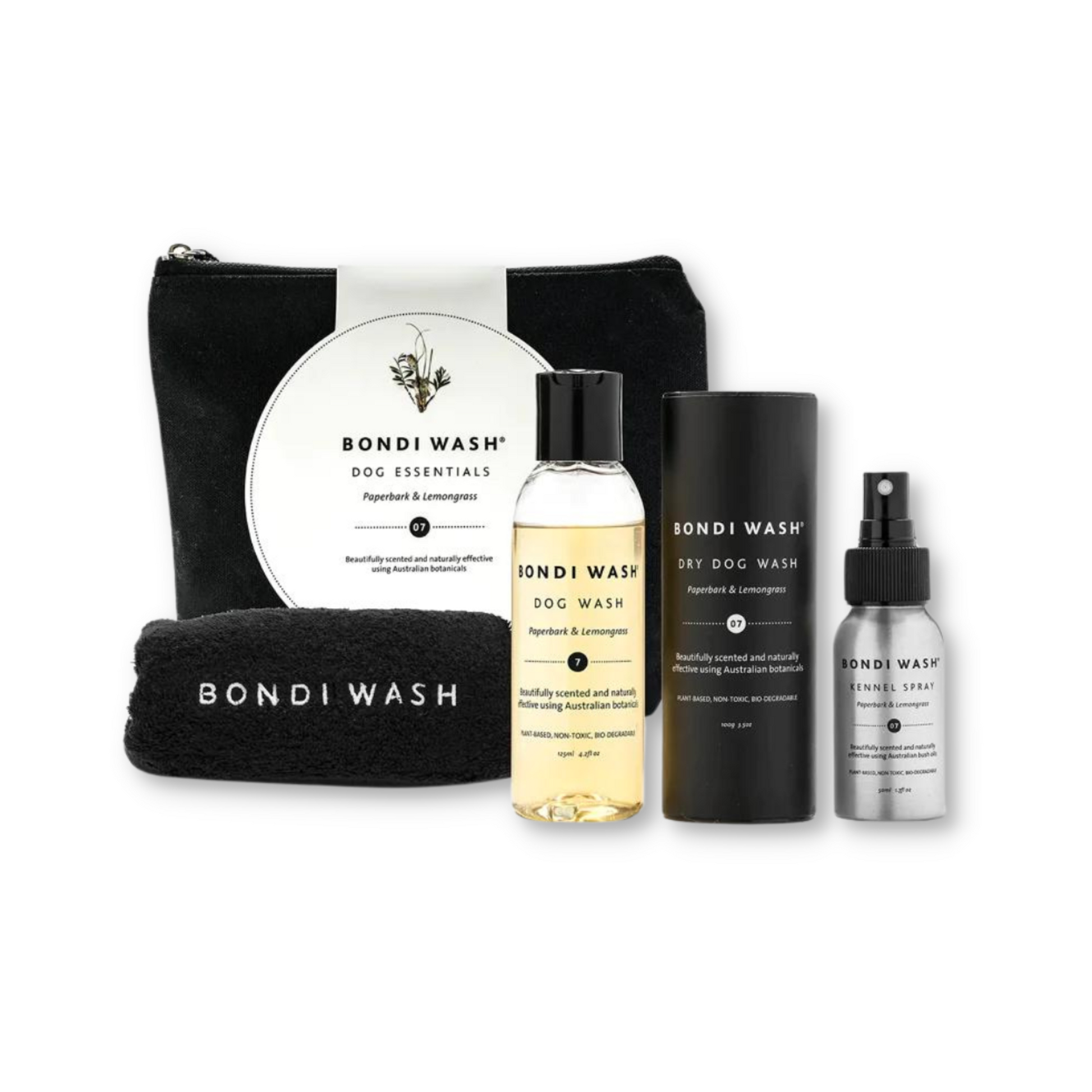 Bondi Wash Dog Essentials Set with dog wash products including shampoo and grooming items in a natural setting.