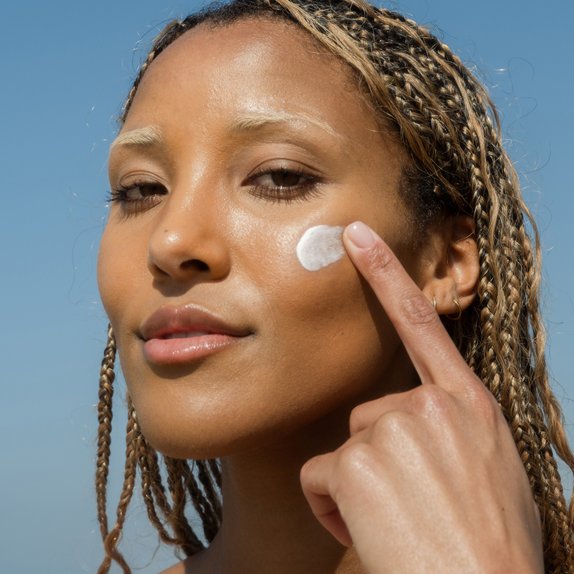 Coola Classic Face Organic Sunscreen Lotion SPF50, fragrance-free, with smooth white lotion in a tube, designed for facial sun protection.