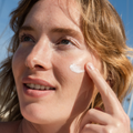 Coola Classic Face Organic Sunscreen Lotion SPF50 with White Tea, white tube with blue cap and product label.