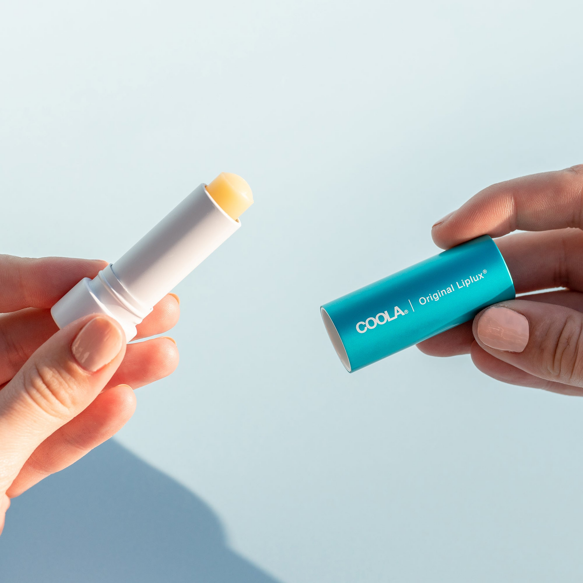 Coola Classic Liplux Organic Lip Balm Sunscreen SPF30 with natural ingredients, in a sleek tube, ideal for protecting lips from sun damage