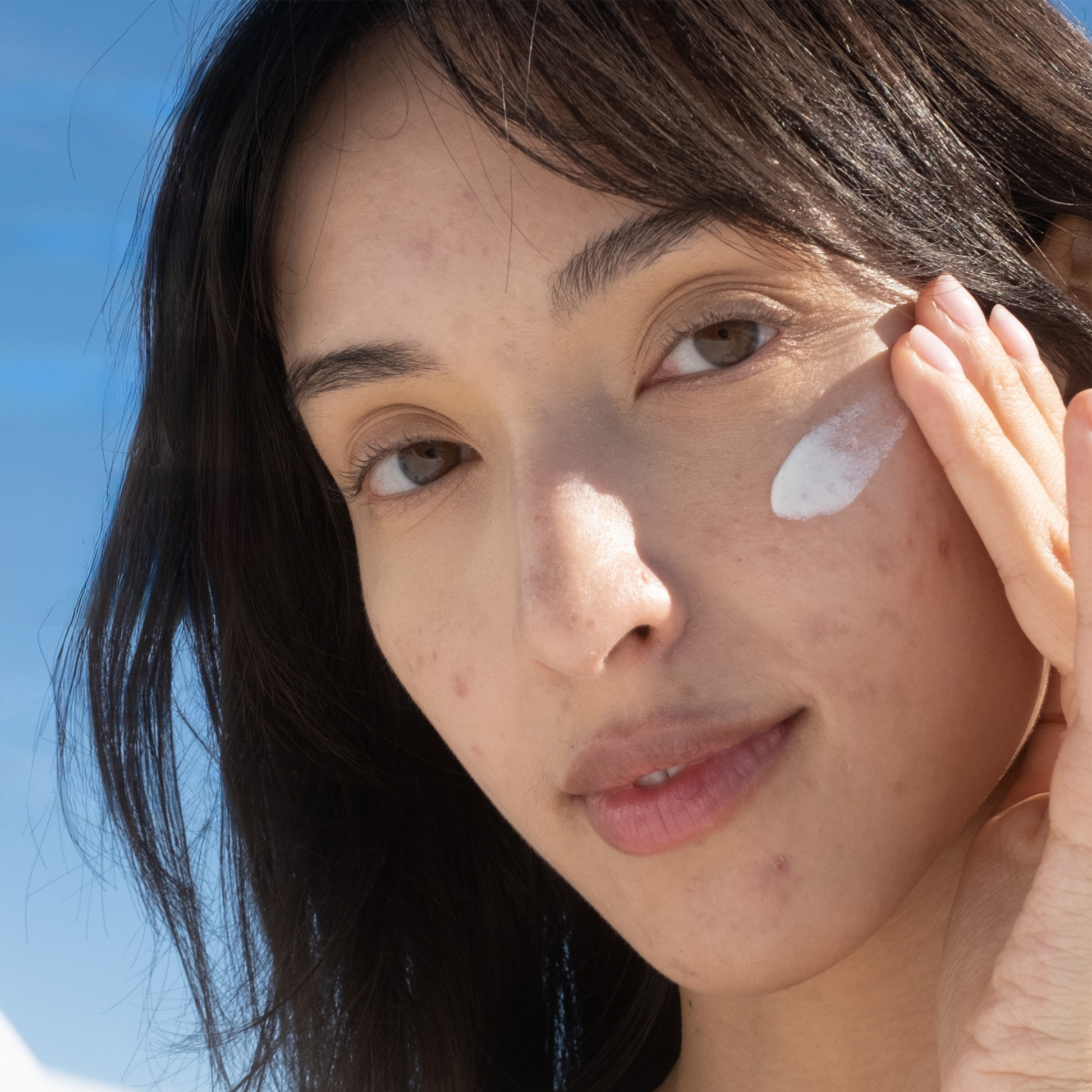 Coola Clear Skin Zinc Oxide Sunscreen SPF30 in a skincare serum bottle with a pump dispenser showing the product label.