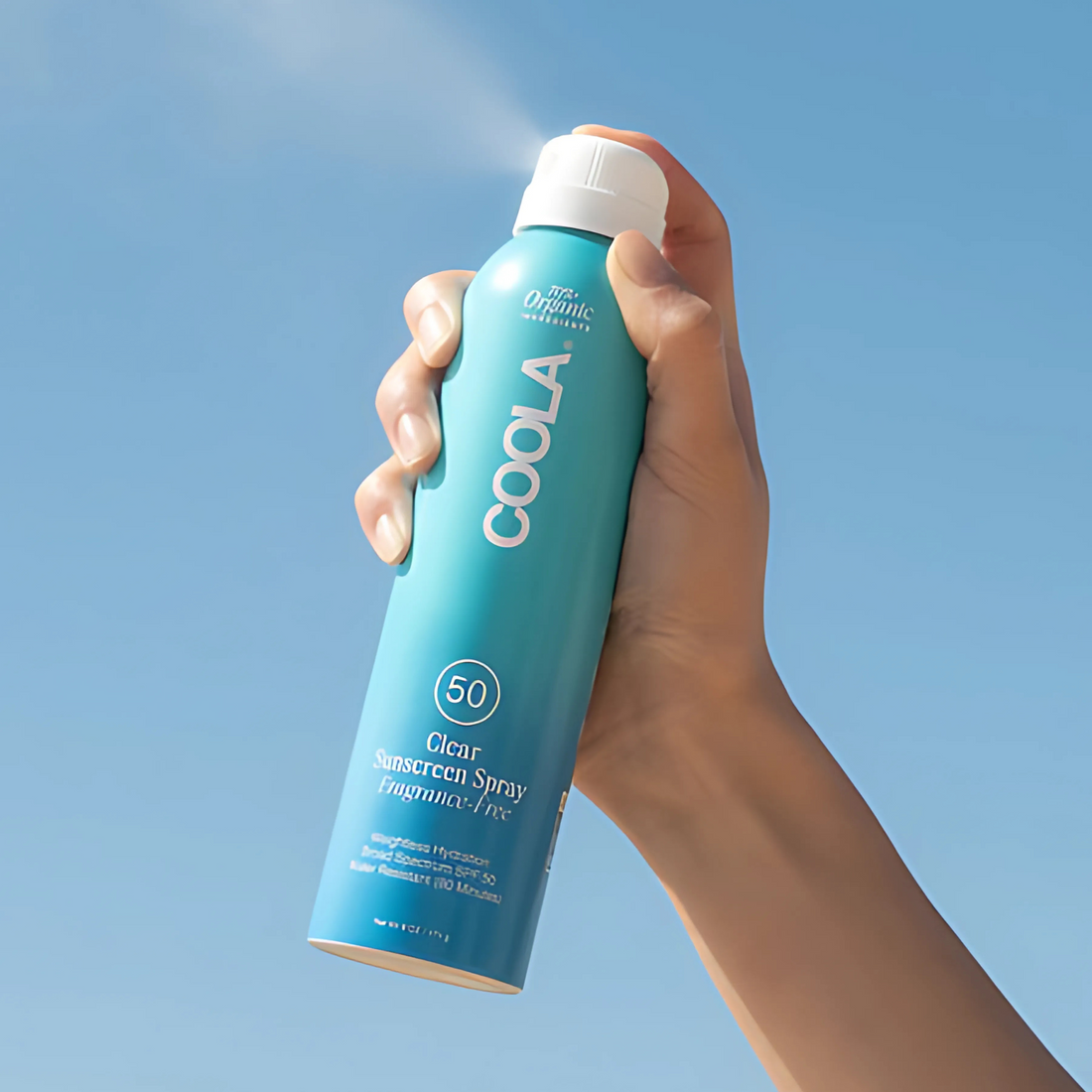 Coola Clear Sunscreen Spray SPF50 from Coola Suncare, fragrance-free, with transparent liquid visible in the spray bottle.