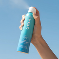 Coola Clear Sunscreen Spray SPF50 from Coola Suncare, fragrance-free, with transparent mist for broad-spectrum sun protection.