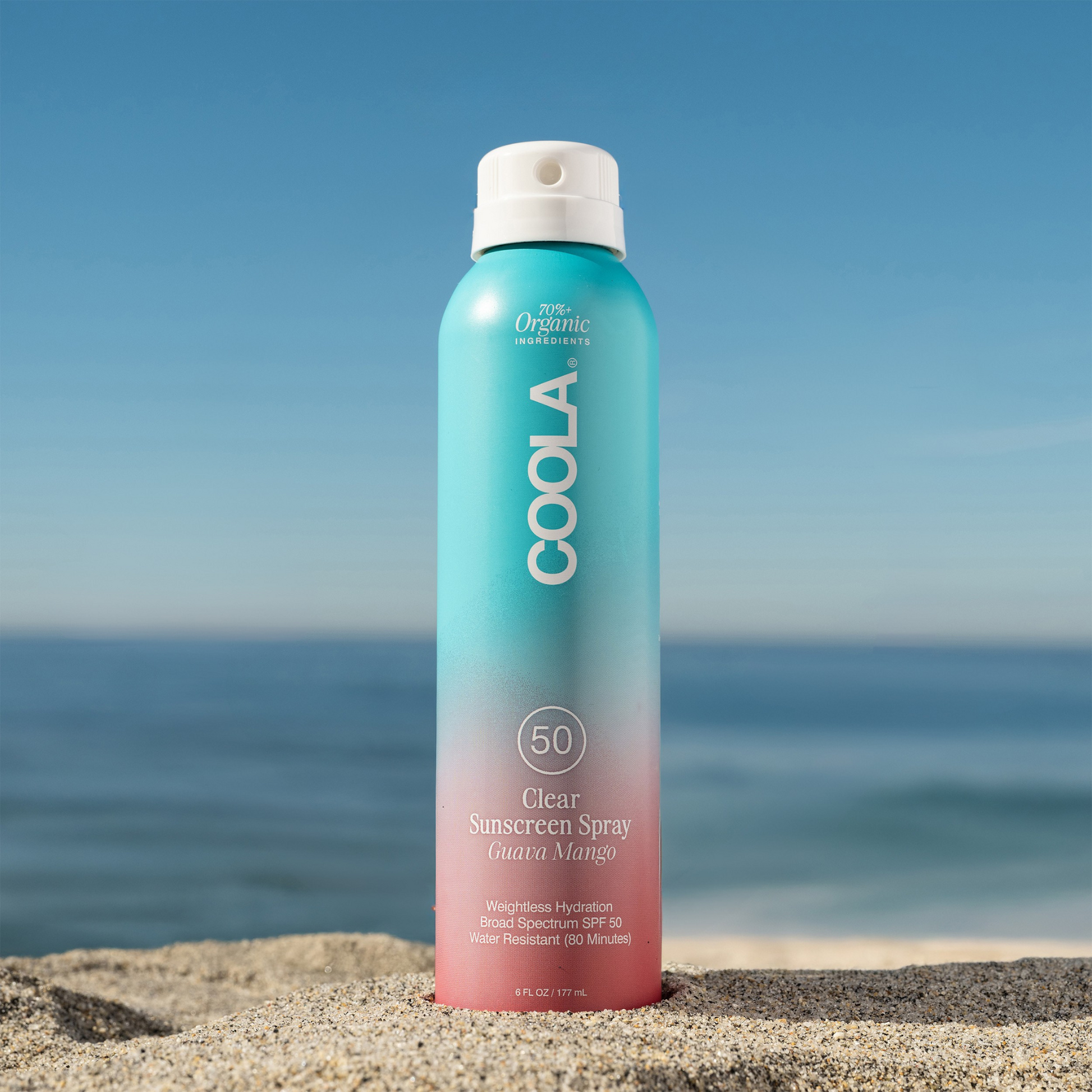 Coola Suncare Clear Sunscreen Spray SPF50 with Guava Mango scent, showing the transparent spray bottle and vibrant fruit design.