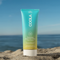 Coola Hydrating Sunscreen Lotion SPF30 with Pina Colada scent, showing the white lotion container with tropical-themed label.