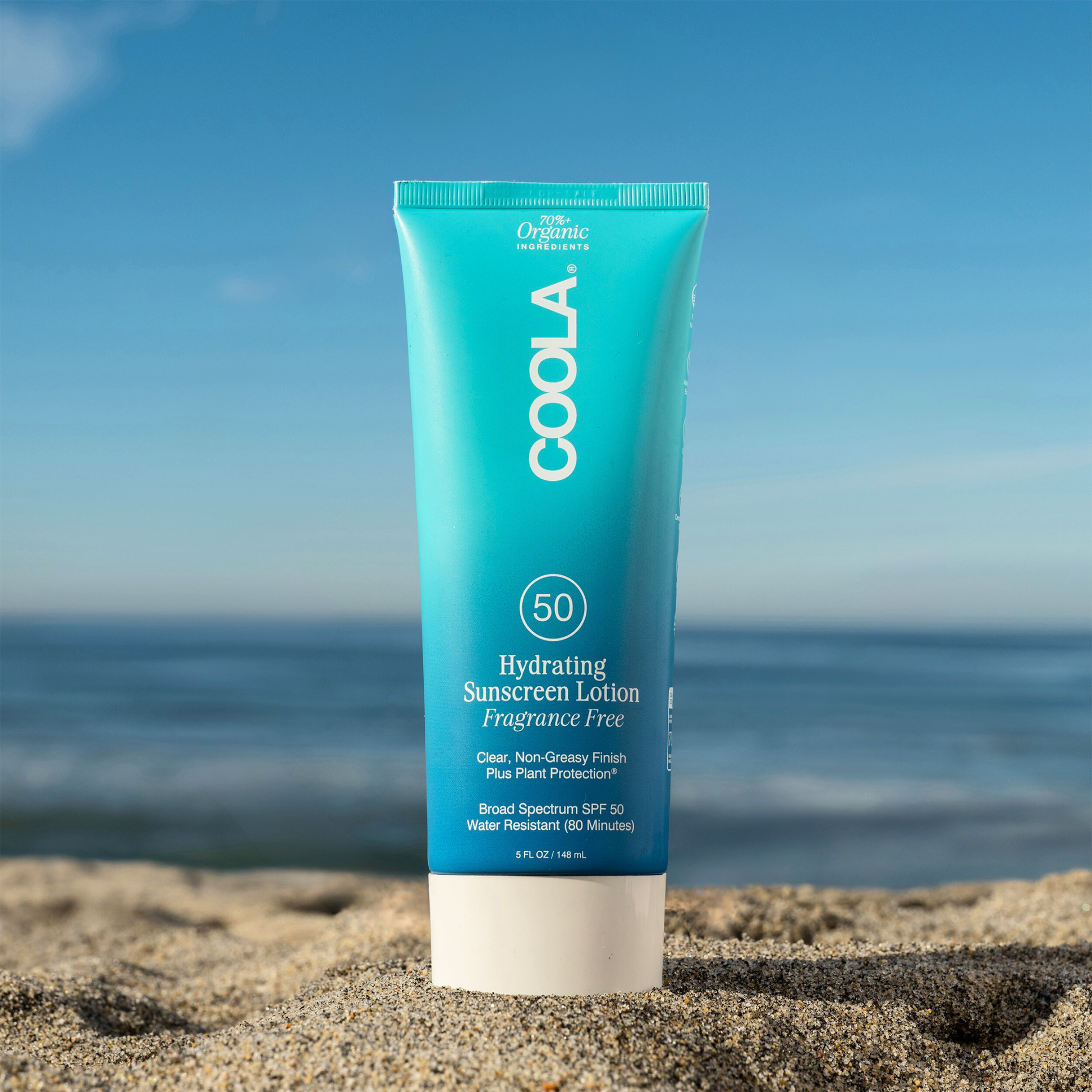 Coola Hydrating Sunscreen Lotion SPF50, fragrance-free, in a white bottle with a pump dispenser, designed for sun protection.