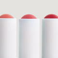 Coola Suncare Coola Liplux Organic Tinted Mineral Lip Sunscreen Trio SPF30 lip balms with natural tinted finishes.
