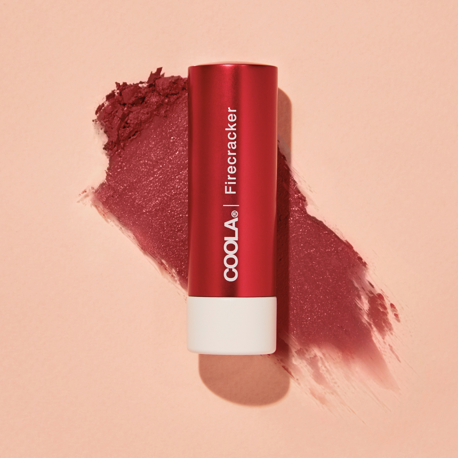 Coola Mineral Liplux Organic Tinted Lip Balm with SPF 30 in Firecracker shade, featuring natural ingredients and moisturizing texture.