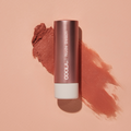 Coola Mineral Liplux Organic Tinted Lip Balm with SPF 30 in Nude Beach shade, showing the smooth, tinted lip balm stick.