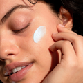 Coola Suncare Refreshing Water Plumping Gel Serum with SPF30, clear gel texture, and hydrating ingredients in a sleek container