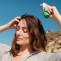 Coola Suncare Organic SPF 30 scalp and hair mist spray bottle, UV protection for hair and scalp, outdoor use.