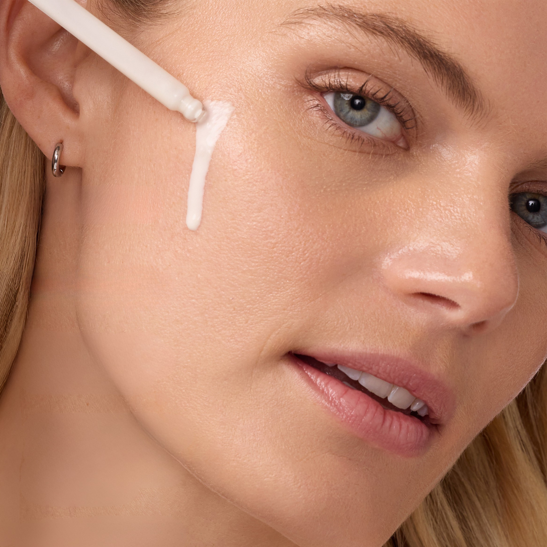 Coola Sun Silk Drops organic face sunscreen serum with SPF 30, featuring lightweight, smooth texture for radiant skin protection.