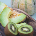 Cuccio Naturalé Melon and Kiwi cuticle revitalizing oil in a small bottle, perfect for nourishing and moisturizing cuticles.