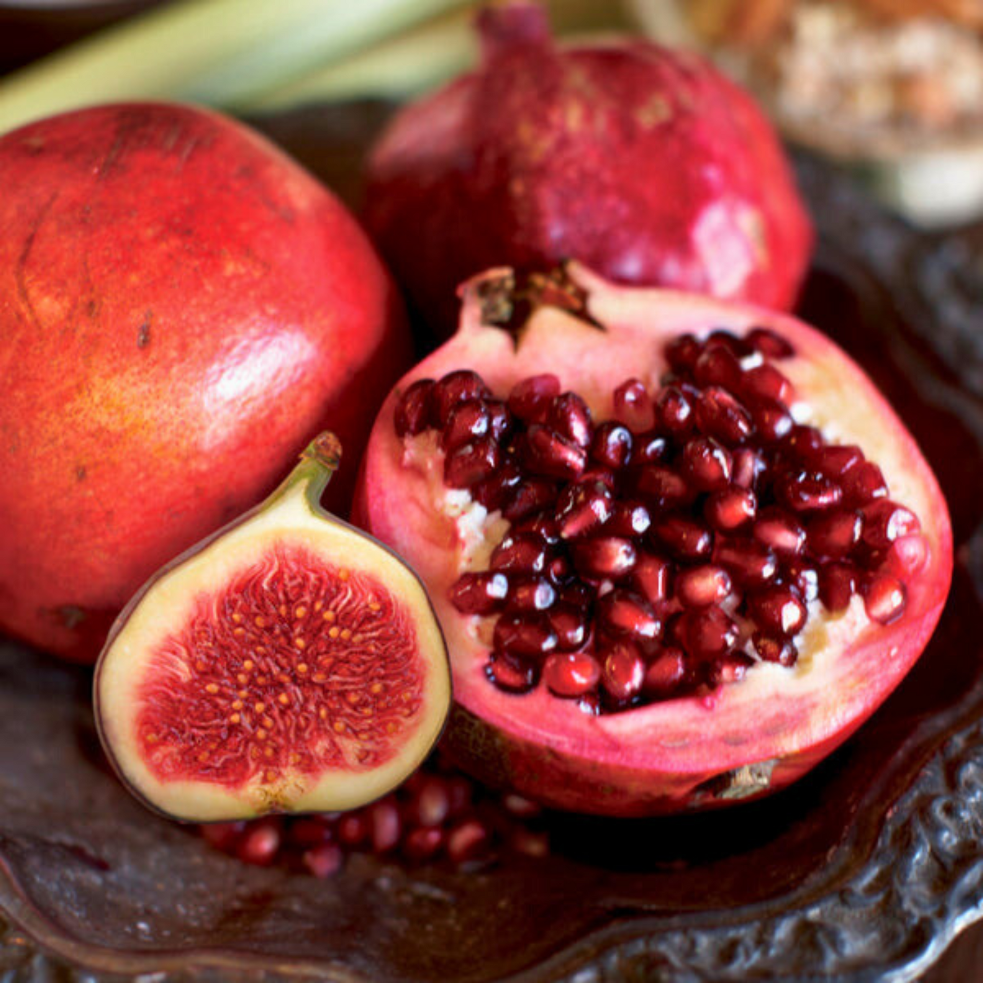 Cuccio Naturalé hydrating lotion with pomegranate and fig scent, showcasing the creamy moisturizer in a pump bottle.