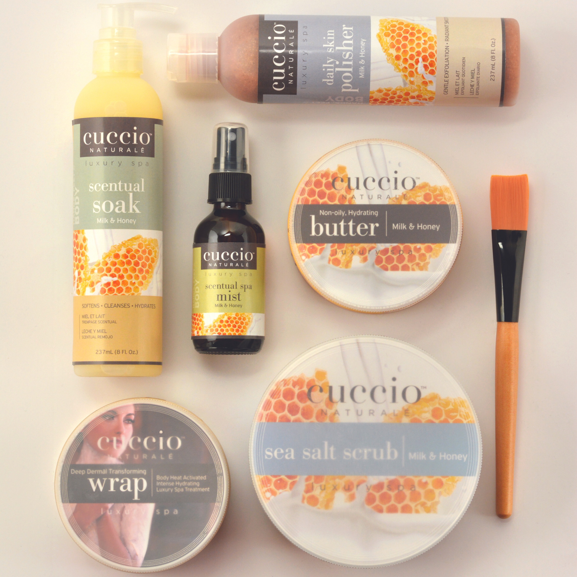 Cuccio naturale milk and honey products on a light white background