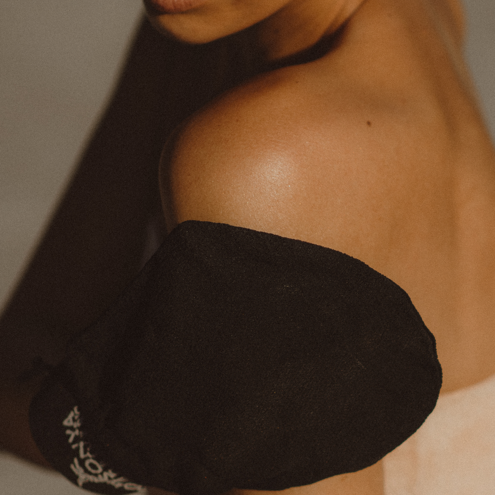Eco by Sonya Driver exfoliating glove designed for self-tanning, showing a textured, soft exfoliation glove in the image.
