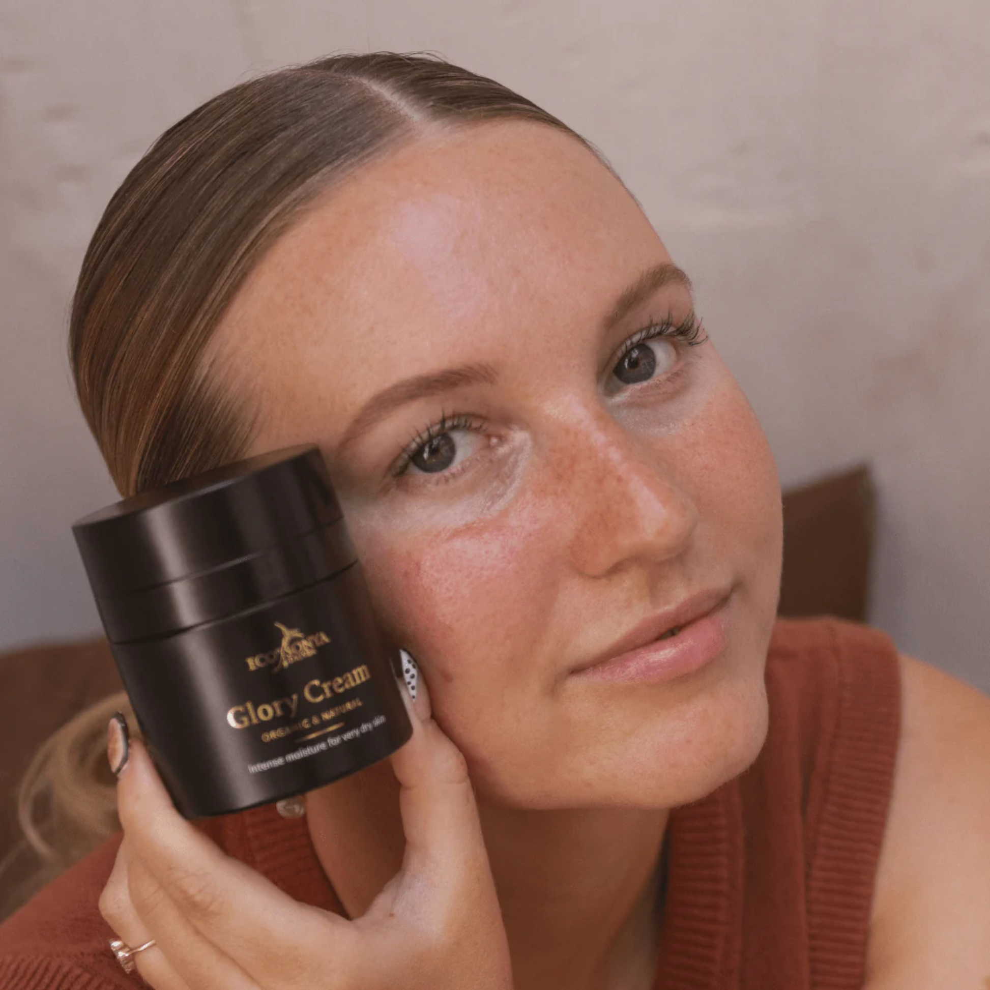 Eco by Sonya Driver Glory Cream skincare serum in a glass jar with a white lid, showcasing a smooth, creamy texture.