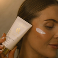 Eco by Sonya Driver Glory Veil SPF50 face sunscreen lotion in a tube, showing the product packaging and branding.