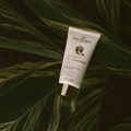 Eco by Sonya Driver Glory Veil SPF50 face sunscreen lotion in a white tube with a blue cap, ready to protect skin from UV rays.