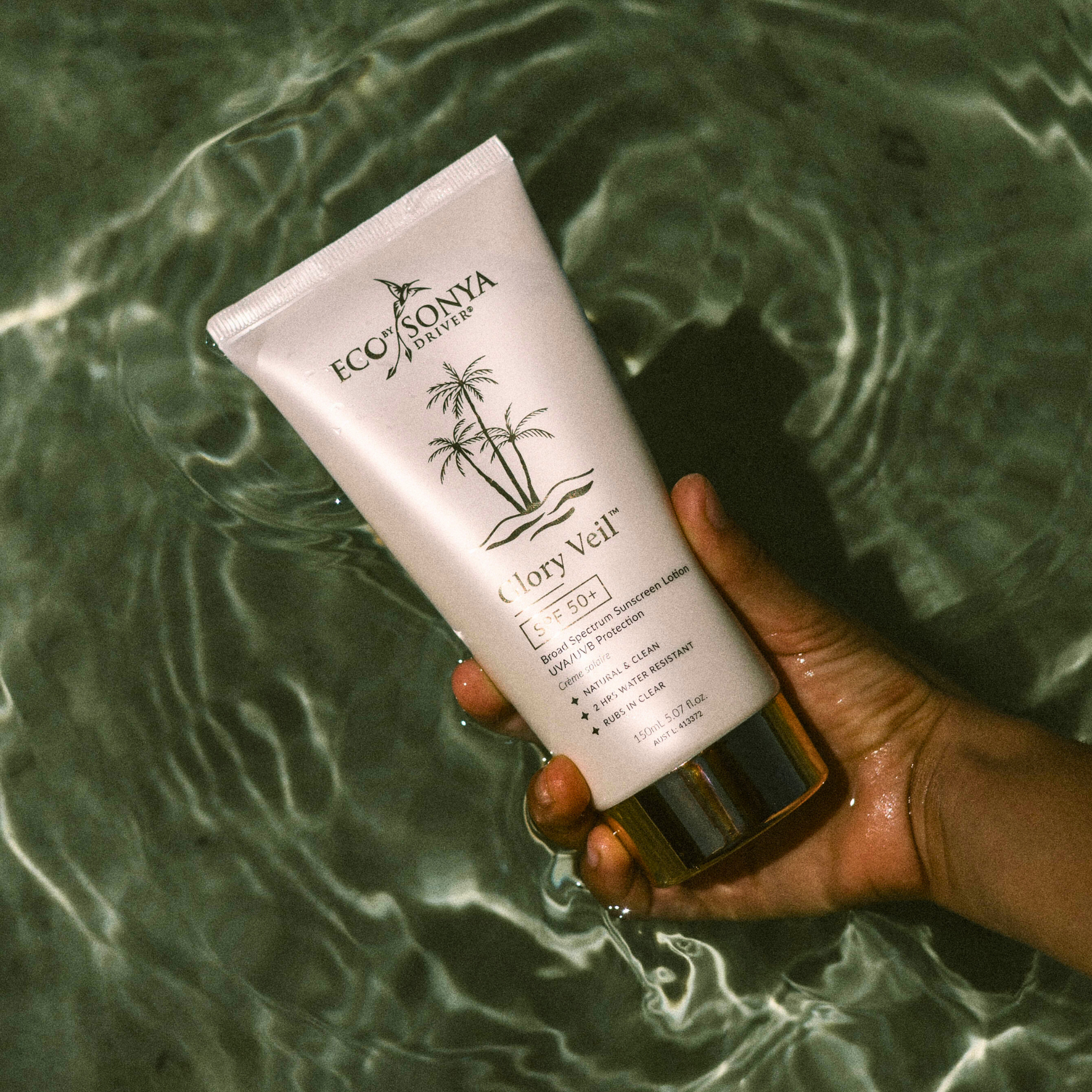 Eco by Sonya Driver Glory Veil Sunscreen Lotion SPF50+ in a white tube with a blue cap, designed for sun protection.