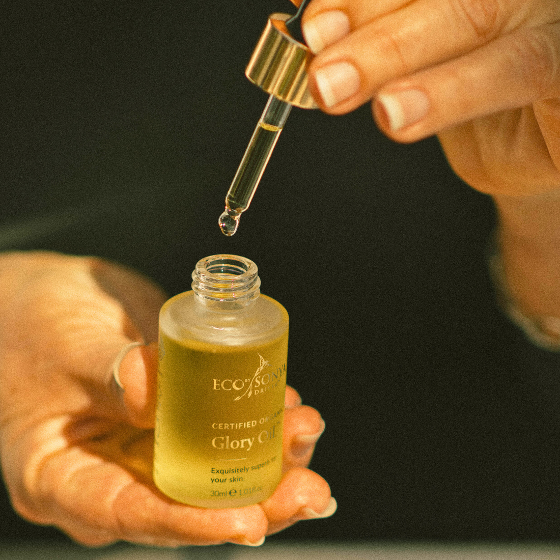 Eco by Sonya Driver Organic Glory Oil skincare serum in a 30ml bottle, featuring a clear glass container with a dropper lid.