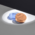 Élan Brow Top eyebrow styling wax in a compact container, designed for shaping and defining eyebrows.
