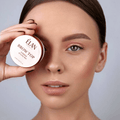 Élan Brow Top eyebrow styling wax in a compact container, designed for shaping and maintaining eyebrows.