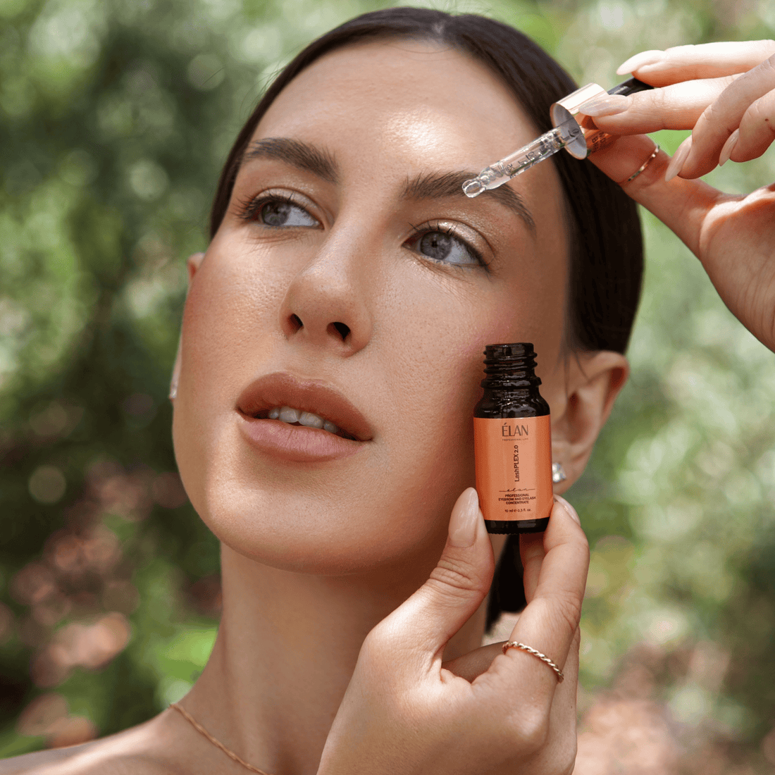 Élan LashPlex Eyelash Concentrate 2.0 from Élan Cosmetics, a lash and brow aftercare serum in a sleek bottle.