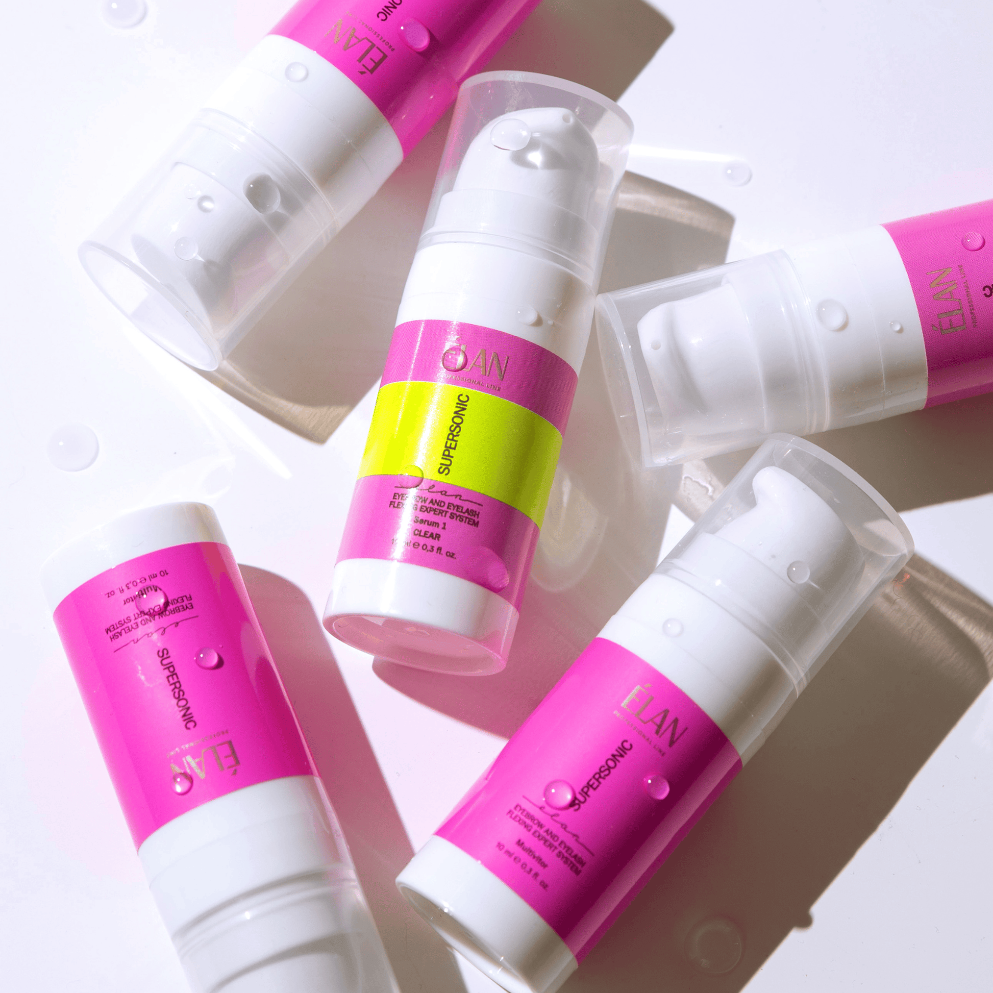 Élan Supersonic 2.0 serum for lashes and brows lamination, with a close-up of the clear serum bottle and applicator.