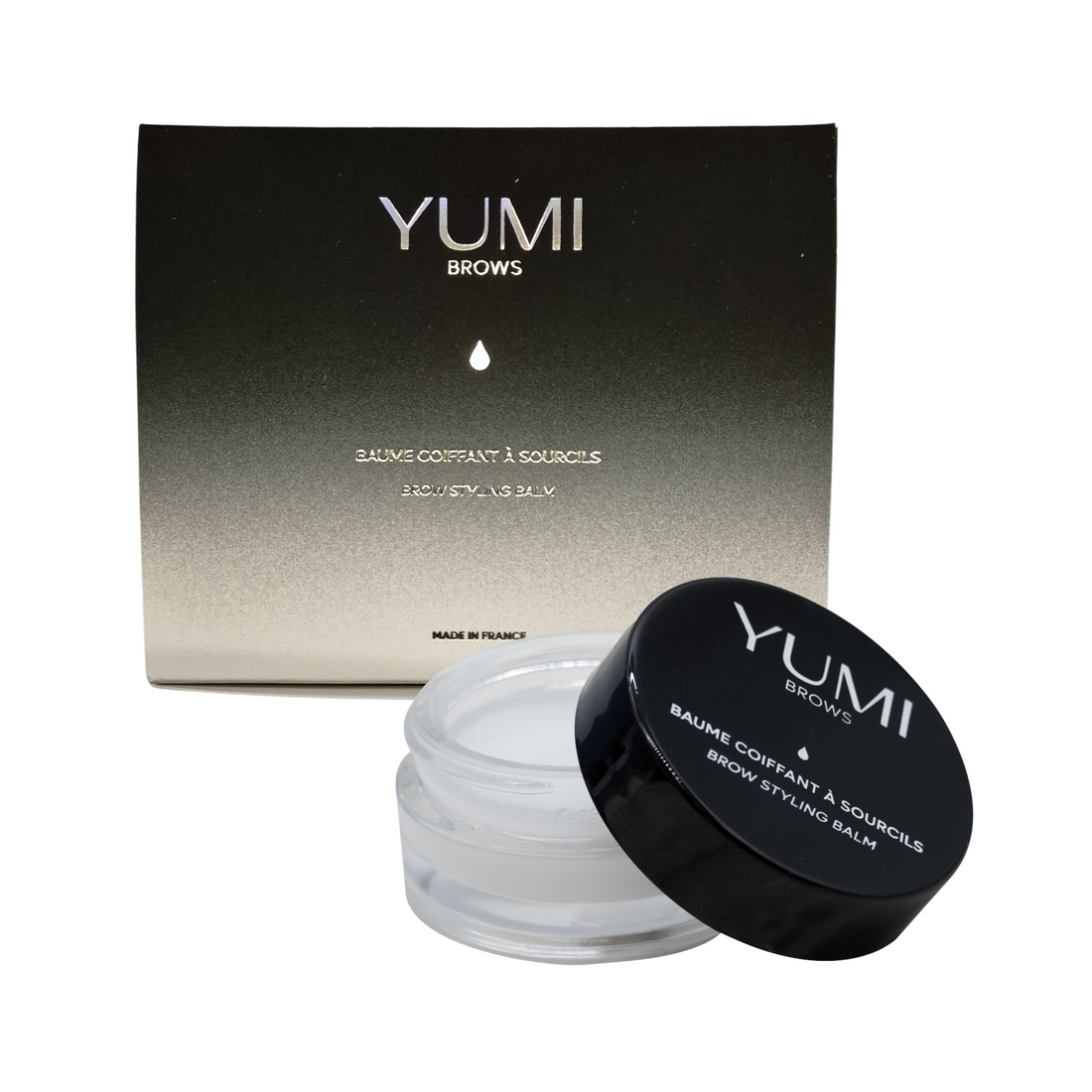Yumi Brows Brow Styling Balm in a small jar, showcasing the product label and the dark brown color of the balm.