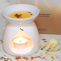 White Yumi Beauty ceramic fragrance burner for candles, featuring a sleek, modern design perfect for aromatherapy and home decor.