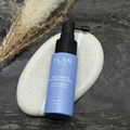 Yumi Haircare Anti White Hair Protein Serum bottle, hair care product for reducing white hair, with nourishing serum inside.