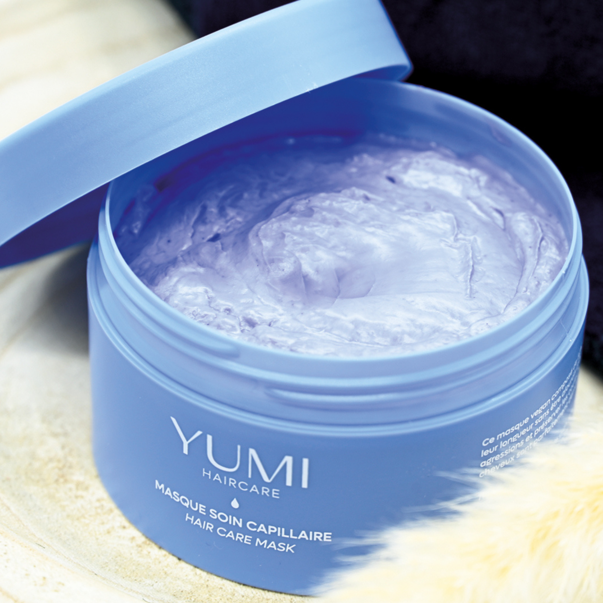 Yumi Haircare hair mask in a 250ml container, nourishing treatment for healthy, shiny hair.